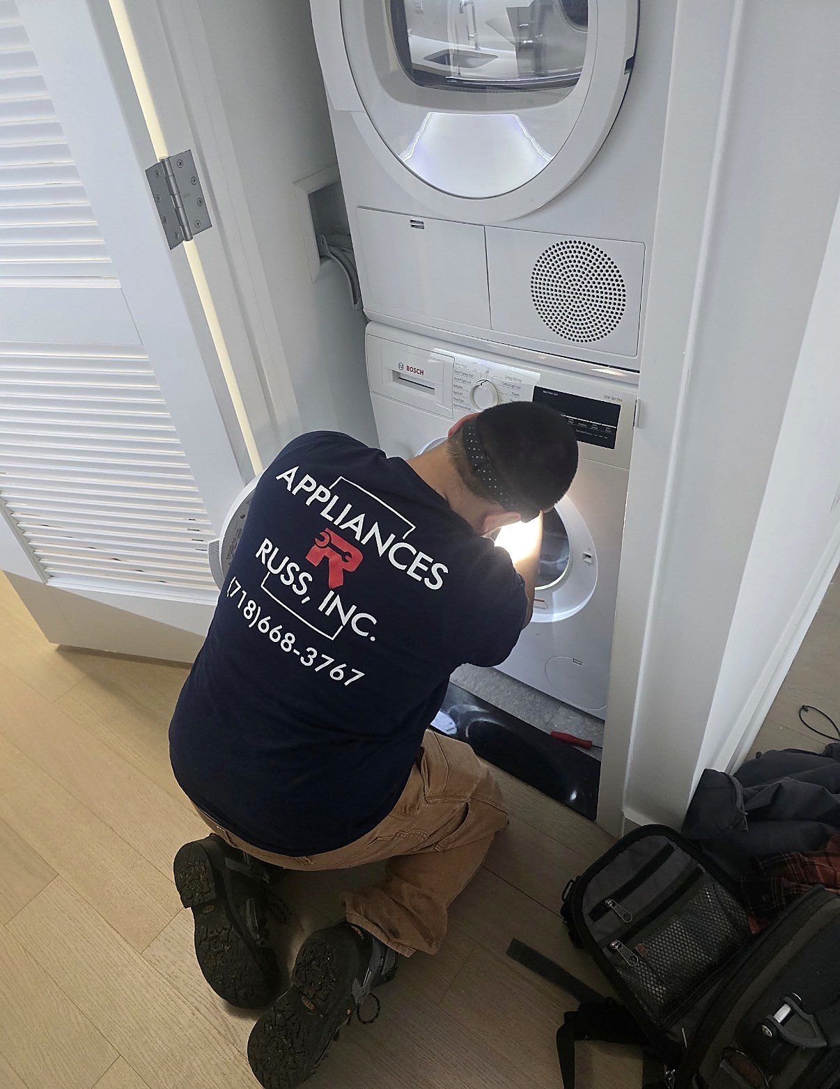 Russ at a stacked washer and dryer
