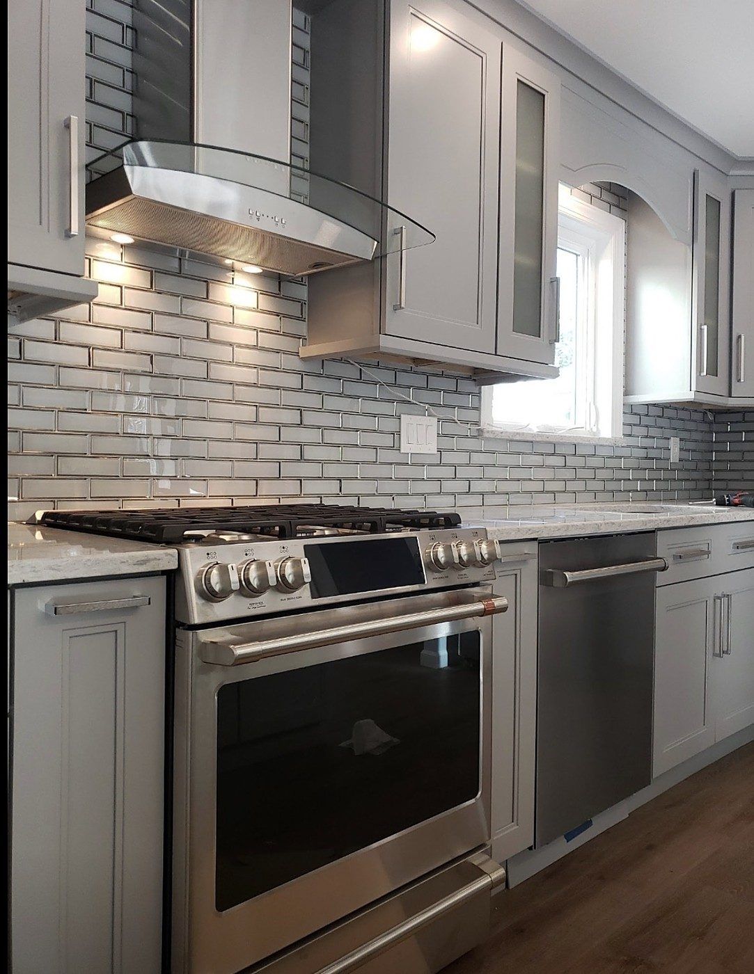 Range, dishwasher and glass hood