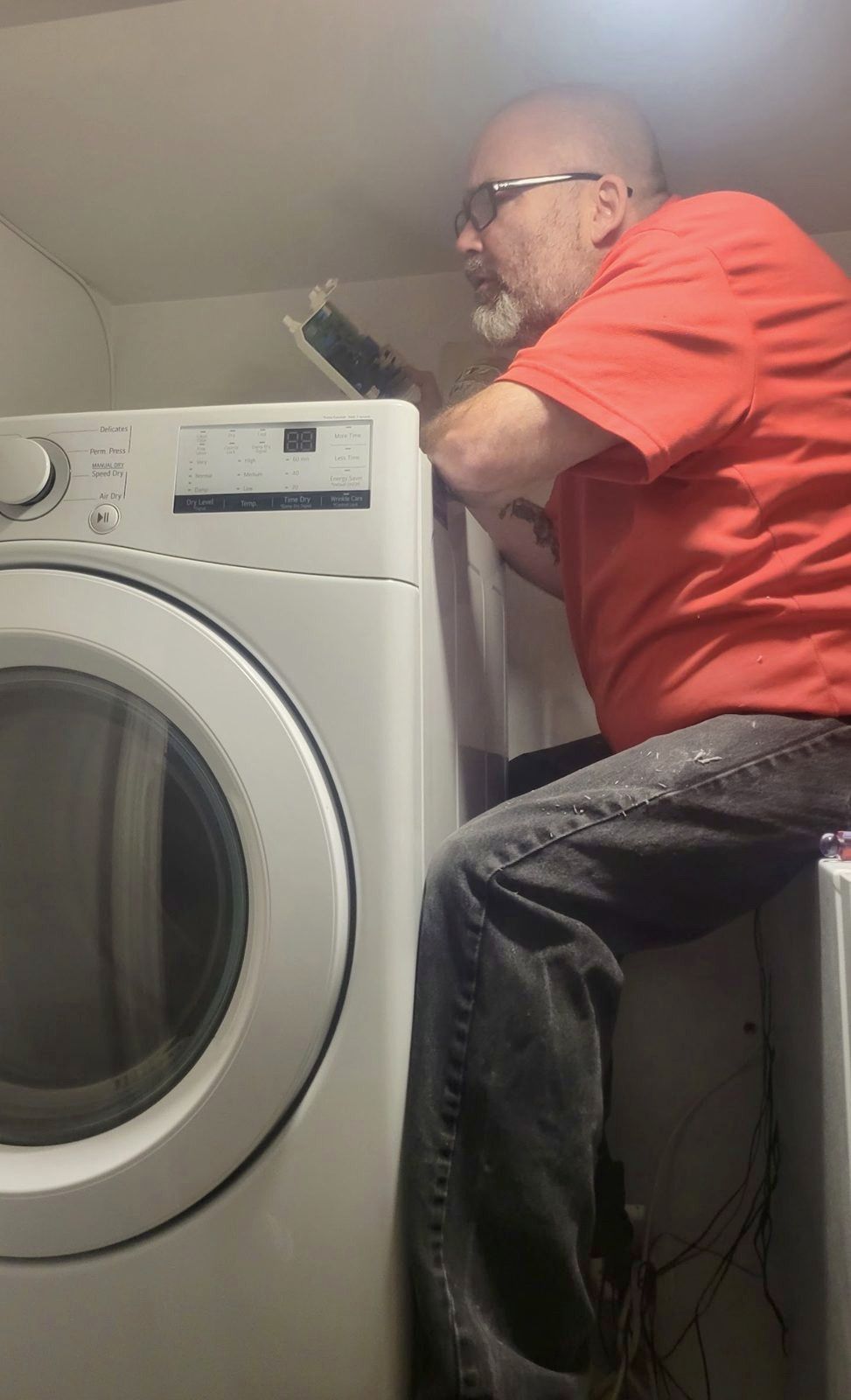 Russ looking at a dryer